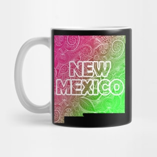 Colorful mandala art map of New Mexico with text in pink and green Mug